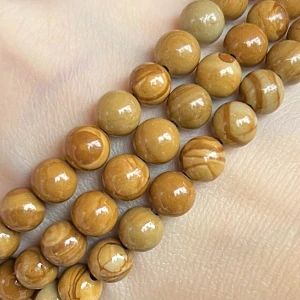 Zkamenělé dřevo, 6,5-7 mm, šňůra 38 cm (cca 62 korálků)